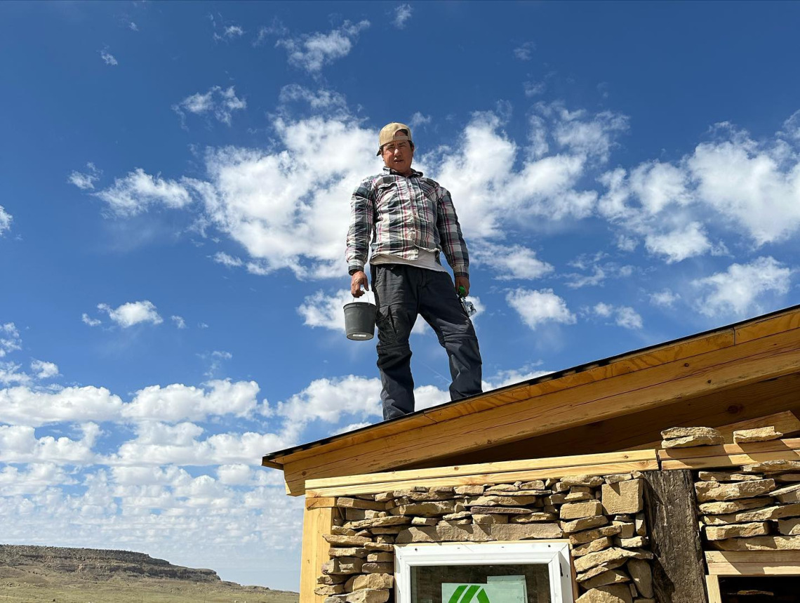 Dr Johnson standing on his roof